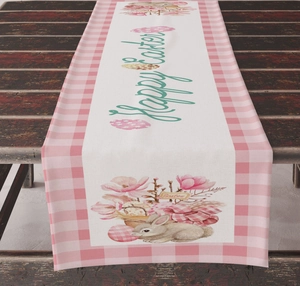Detail of Happy Easter table runner with bunny and eggs on a vintage wood table
