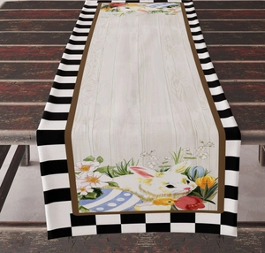 Detail of Easter table runner with bunny, colored eggs, and chic striped borders