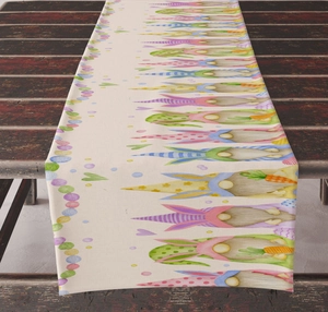 Detailed fabric texture of Easter table runner featuring gnome and colorful egg patterns