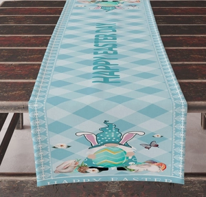 Detail of Easter table runner with gnome and bunny prints on a rustic wooden table