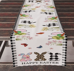 Detail of Happy Easter table runner with bunny, floral patterns and black white buffalo plaid edge