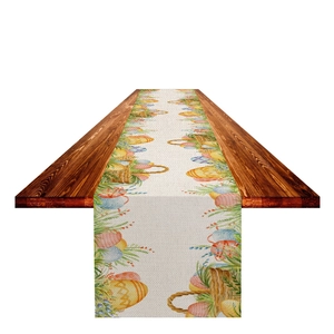 Detail of Easter table runner featuring watercolor eggs and rabbit patterns on fabric