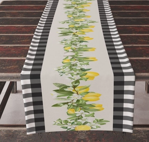 Close-up of linen table runner with realistic lemon print and black gingham borders
