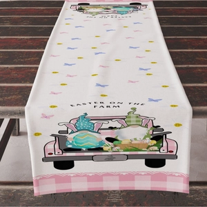 Easter farm table runner with pink trucks and gnomes on rustic wooden dining table