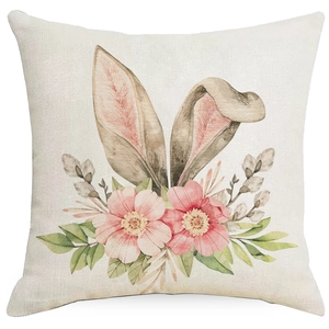 Pink Easter linen pillow case featuring watercolor bunny ears and floral illustration