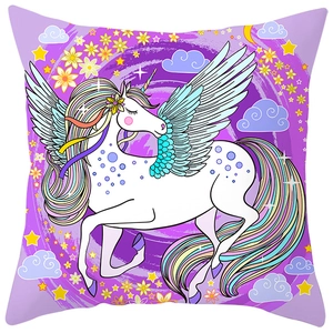 Detail of colorful unicorn print on soft peach skin fabric decorative pillowcase