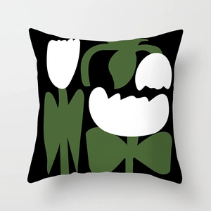 Detailed view of square pillowcase with abstract black, white and green floral art pattern