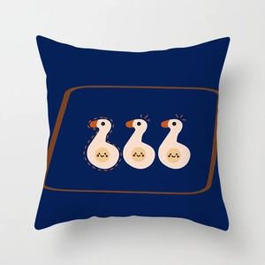 Detail of navy blue cushion cover with cute cartoon duck illustrations and brown border