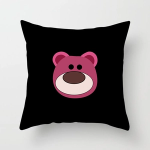 Close-up of black square pillowcase featuring a pink cartoon bear design on soft fabric
