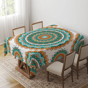 Detailed view of bohemian mandala pattern fabric on a rectangular blue dining tablecloth