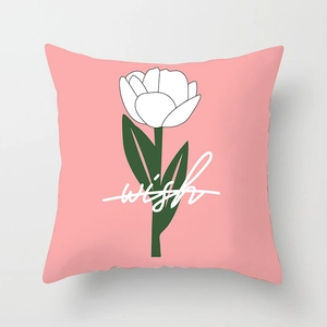 Pink Nordic pillowcase featuring white tulips and artistic wish text on a gray background