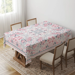 Detailed pattern of bohemian mandala tablecloth with floral prints on a wooden table