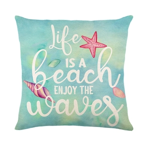 Linen cushion cover with blue starfish print and Life is a Beach typography art