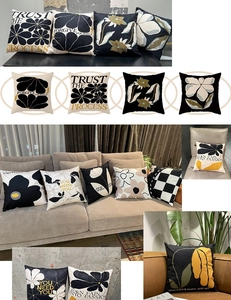 Detail of floral and motivational quote patterns on minimalist home cushion covers