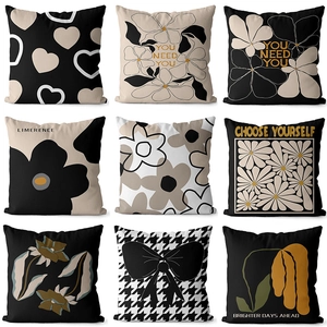 Set of 9 modern minimalist cushion covers with black, white and ochre botanical prints