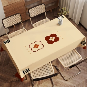 Detail of velvet tablecloth featuring persimmon floral patterns and lucky calligraphy