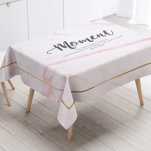 Detail of pink marble tablecloth with gold accents and inspirational quote for home decor