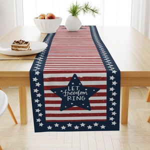 Detail of Fourth of July linen table runner with stars and LET freedom RING text