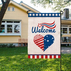 Detail of linen Independence Day garden flag with Welcome text and USA heart design