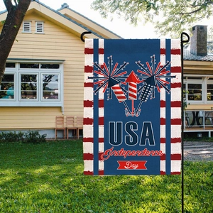 Detail of USA Independence Day garden flag with fireworks design on textured burlap fabric