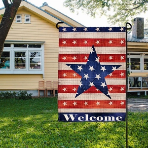 Detail of double-sided burlap American garden flag with Welcome text and stars stripes
