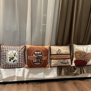 Set of four plush decorative pillow covers with geometric plaid and floral prints