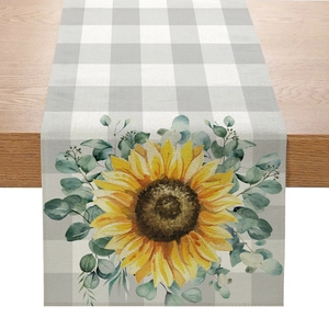 Linen table runner with yellow sunflower, eucalyptus leaves, and grey plaid pattern print