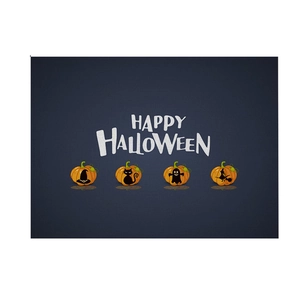 Detail of Halloween linen placemat featuring pumpkins and Happy Halloween text