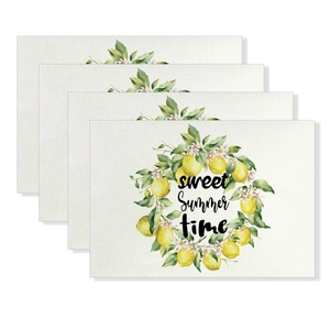 Detailed view of four cotton linen placemats with sweet summer lemon and floral wreath prints