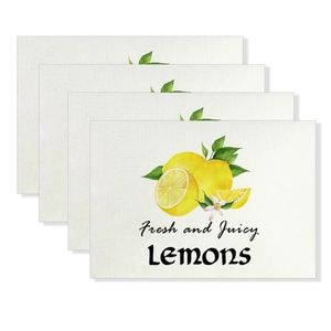 Set of four linen placemats featuring yellow lemon watercolor prints and floral patterns