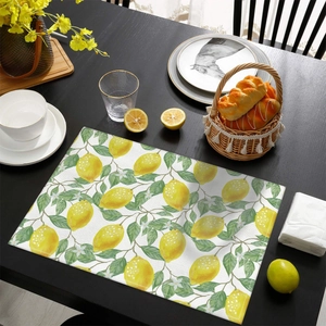 Waterproof lemon leaf print placemat on dark wood table for summer dining decor