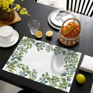 Detail of waterproof lemon leaf print placemat with realistic woven fabric texture on wood table