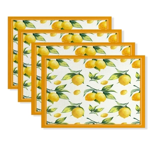 Set of four linen placemats with summer lemon print and orange borders on white background