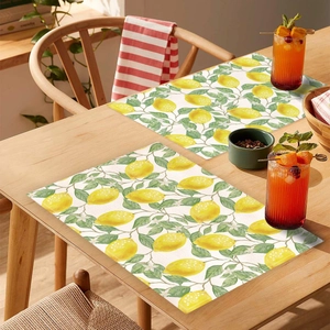 Waterproof lemon leaf print placemats for summer dining table decor in a two-piece set
