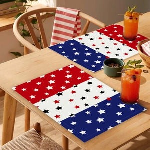 Macro detail of rectangle American flag placemats with stars on a wooden dining table