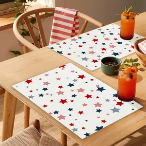 Detailed close-up of Independence Day themed placemats with red and blue star patterns