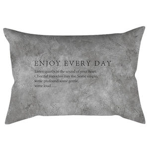 Detail of grey marble texture lumbar pillow cover with black motivational quote print