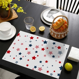 Independence Day placemat with red and blue star patterns on a dark wooden table