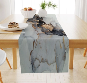 Detail of marble pattern table runner with gold veins on a modern wooden dining table