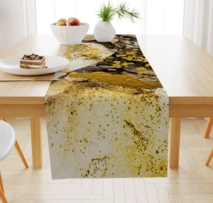 Detailed texture of marble pattern linen table runner with gold accents on wooden table