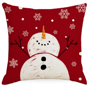Festive red Christmas pillow cover featuring a snowman and snowflake print design