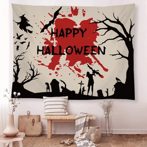 Detail of Halloween tapestry with witch and bat graphics in a cozy room setting