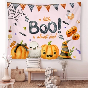 Detail of Halloween baby shower tapestry featuring pumpkins and watercolor ghosts