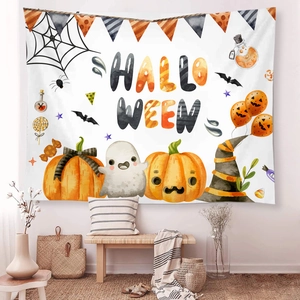 Detail of Halloween tapestry featuring watercolor pumpkin ghost prints in cozy living room decor