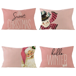 Detailed view of four Christmas pillow covers with pink themes and holiday illustrations