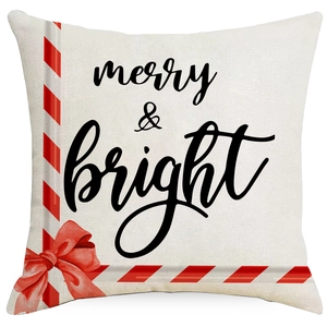 Christmas cushion cover featuring merry and bright print with a festive red bow