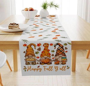 Detail view of linen table runner showing fall gnomes and Happy Fall Y'all text print