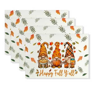 Close-up of Thanksgiving gnomes placemats with woven texture and Happy Fall print