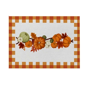 Waterproof Thanksgiving placemat with autumn pumpkin and maple leaf patterns on plaid border