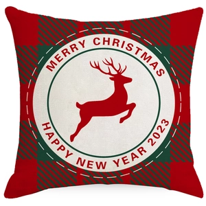 Detail of red and green plaid edge with reindeer print on Christmas pillowcase